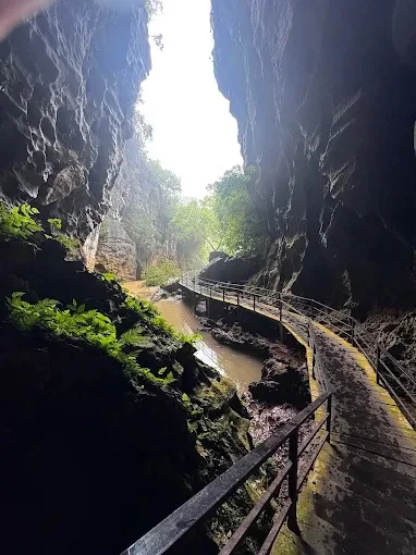 A walkway above the river inside the gorge leading to the Dark Cave entrance