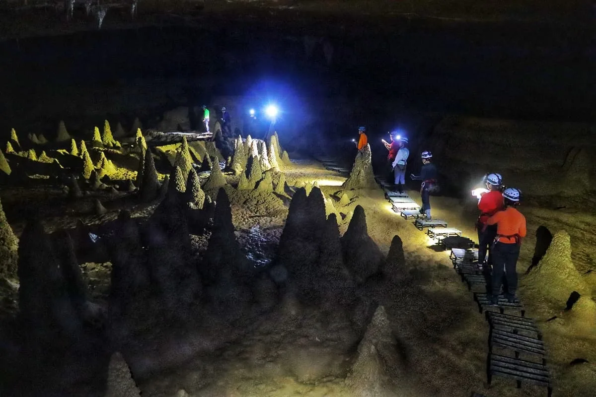 A walkway threading through the field of cone stalagmites in Hang Va
